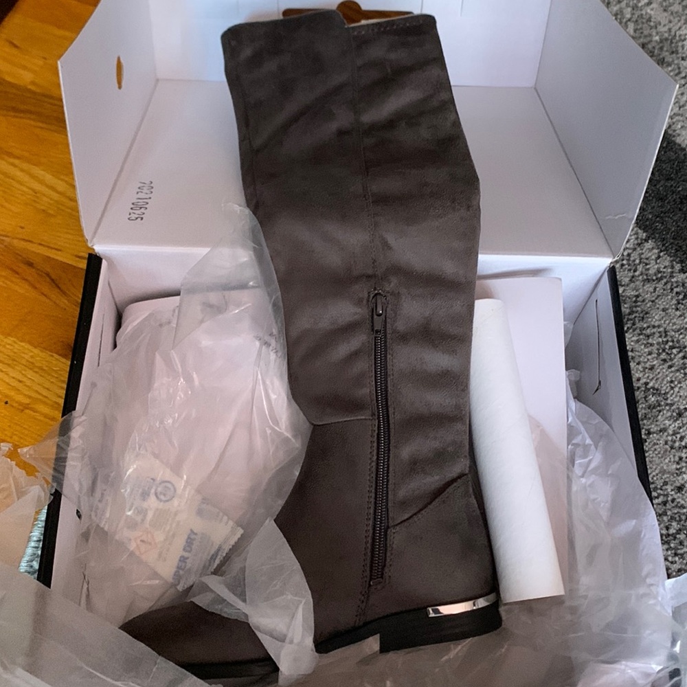 Gray knee high boots , perfect to wear with jeans , dresses , or even leggings